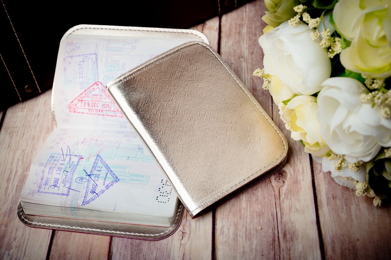 Gold passport holder wedding favour